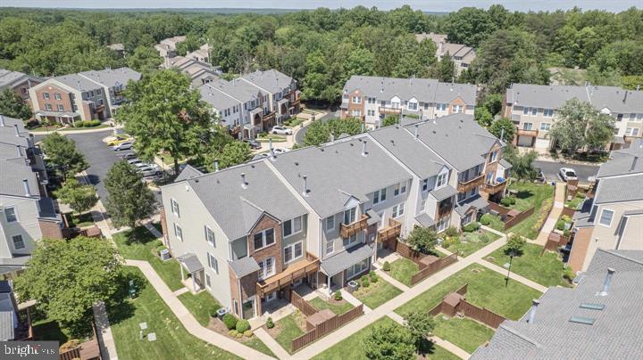 4047 Chetham Way Woodbridge, VA 22192 - Photo 44 of 55 an aerial view of multiple houses with a yard