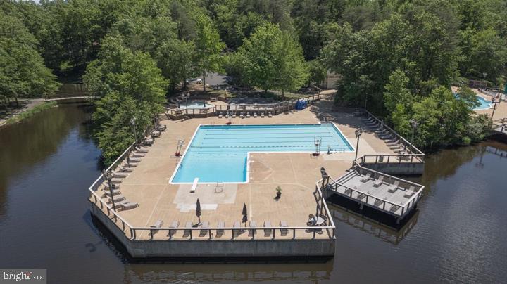 4047 Chetham Way Woodbridge, VA 22192 - Photo 47 of 55 a view of a wooden deck with a lake