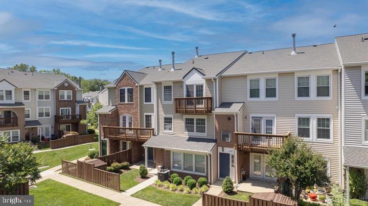 4047 Chetham Way Woodbridge, VA 22192 - Photo 7 of 55 a front view of a building with street view