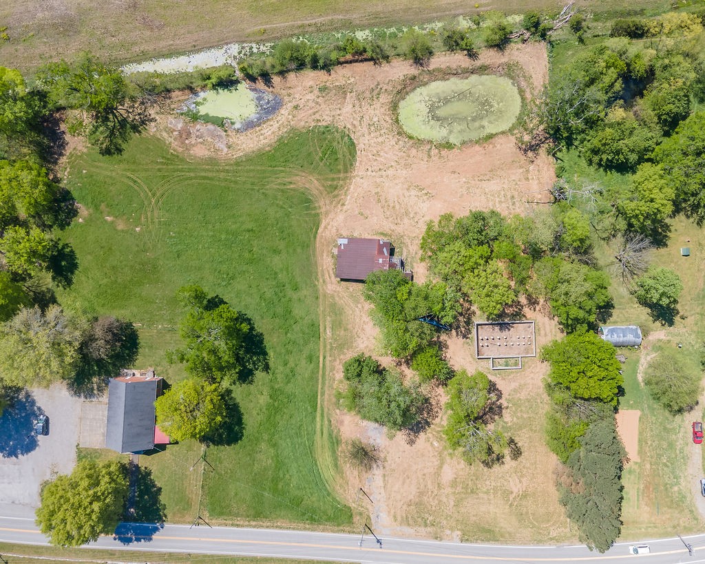3938 Ostella Road Cornersville, TN 37047 - Photo 14 of 17 an aerial view of a house with outdoor space