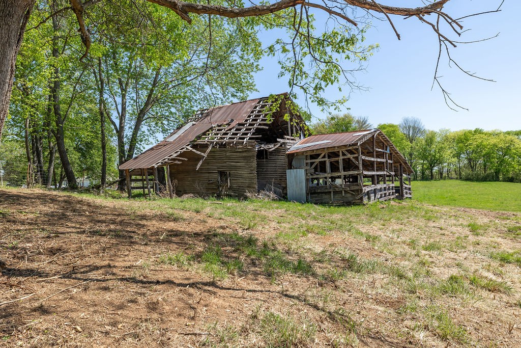 3938 Ostella Road Cornersville, TN 37047 - Photo 8 of 17 a view of a house with a yard