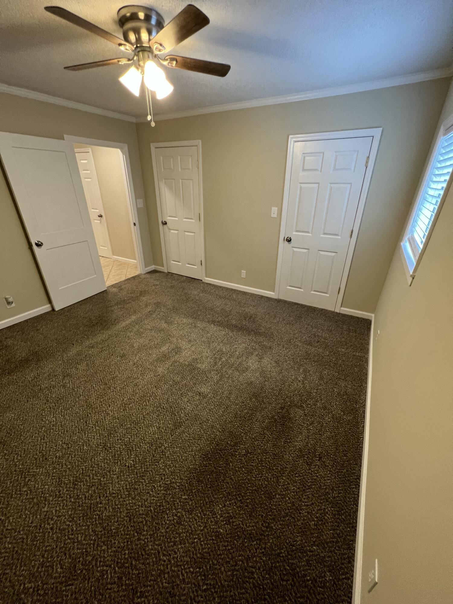 9151 Dallas Hollow Road Soddy Daisy, TN 37379 - Photo 18 of 36 en empty room with fan and window