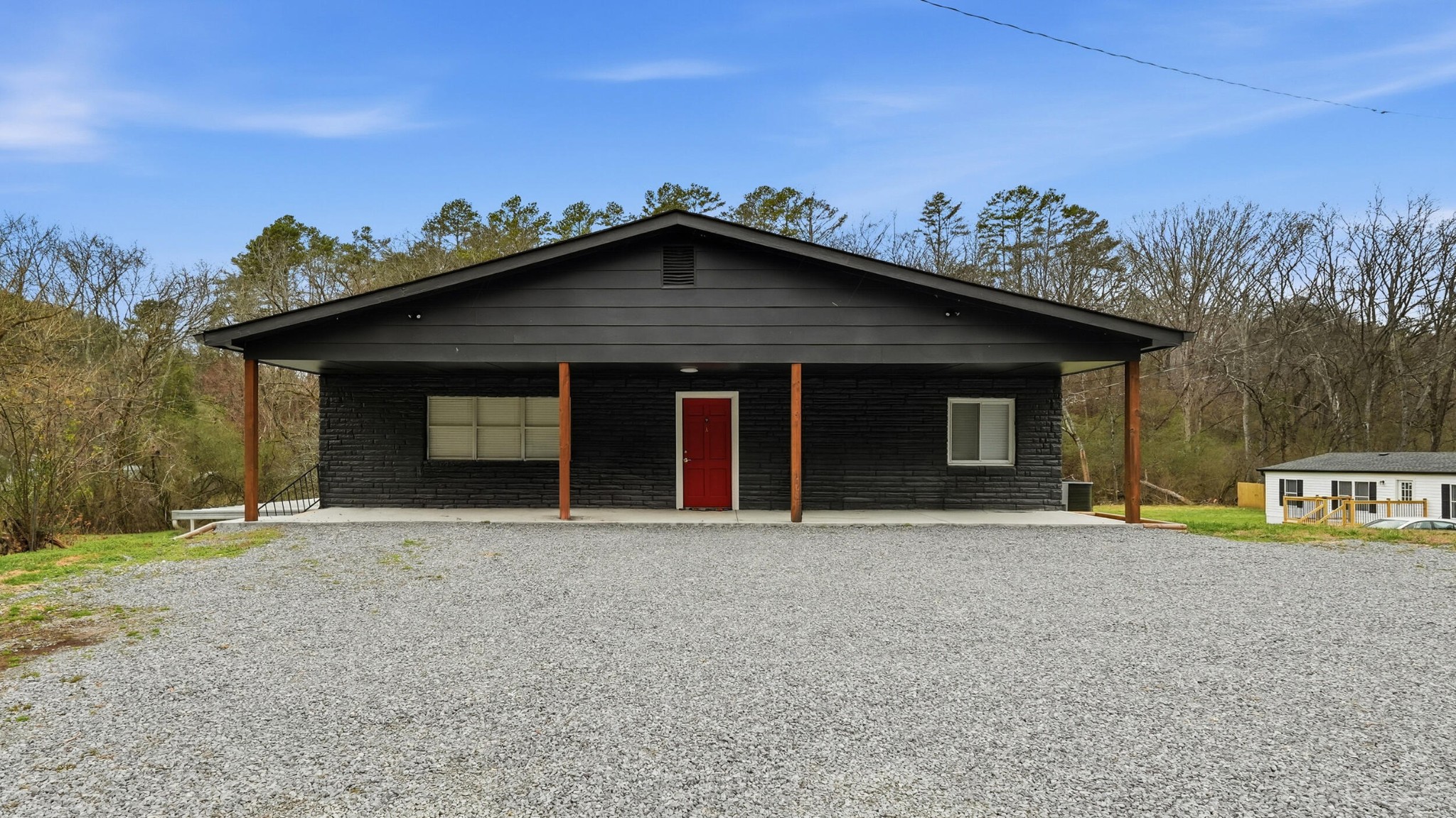 9151 Dallas Hollow Road Soddy Daisy, TN 37379 - Photo 2 of 36 a front view of a house with a yard and garage