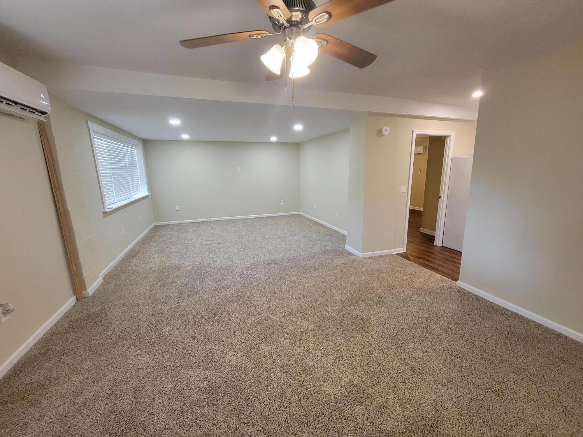 9151 Dallas Hollow Road Soddy Daisy, TN 37379 - Photo 33 of 36 en empty room with windows and entrance