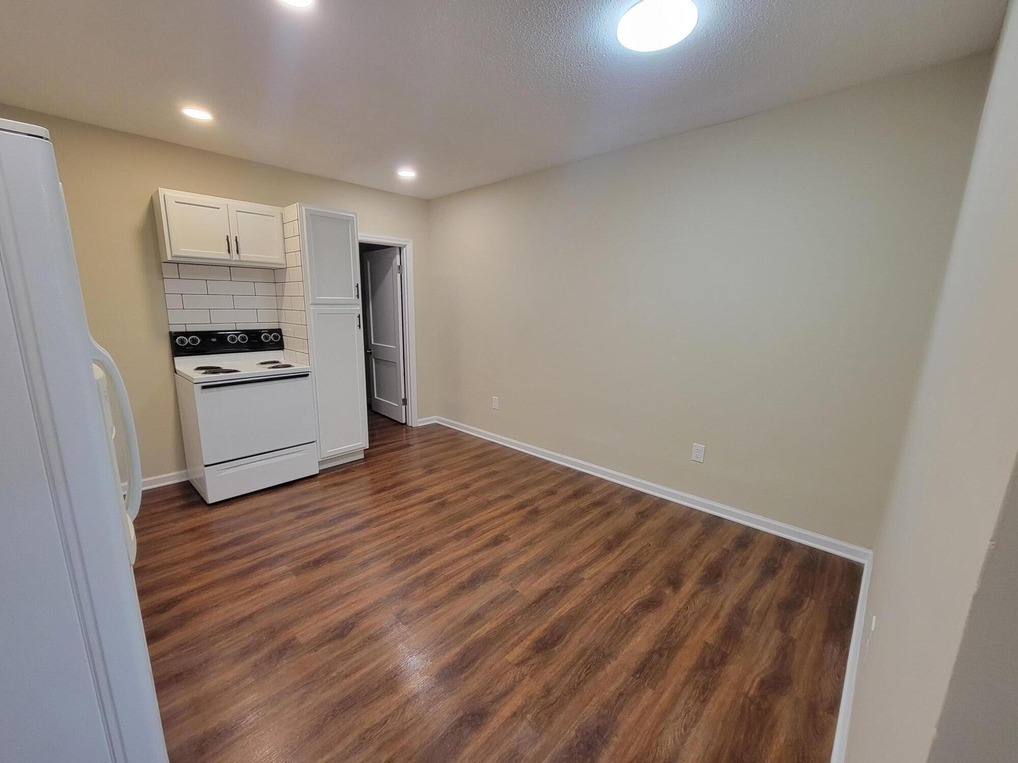 9151 Dallas Hollow Road Soddy Daisy, TN 37379 - Photo 36 of 36 a kitchen with granite countertop white cabinets and stainless steel appliances
