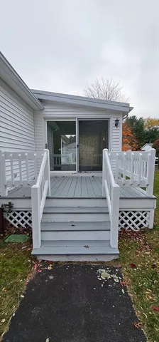 a view of a patio with table and chairs