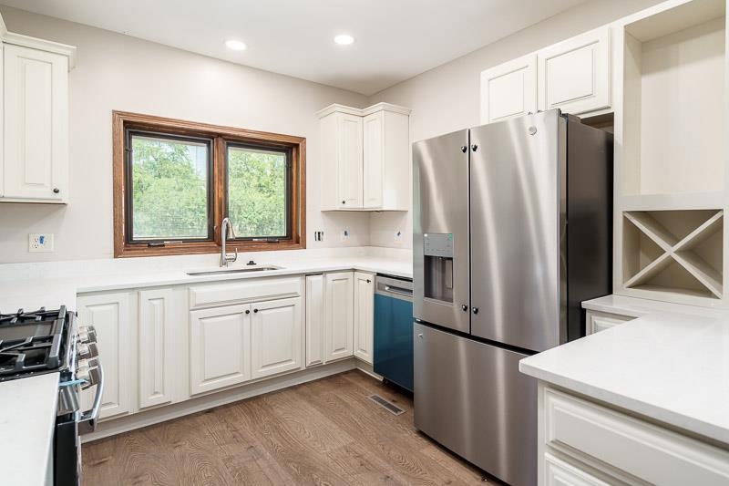 14775 Best Road Davis, IL 61019 - Photo 54 of 76 a kitchen with stainless steel appliances a refrigerator sink and cabinets