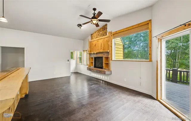 a kitchen with stainless steel appliances kitchen island a refrigerator sink and cabinets