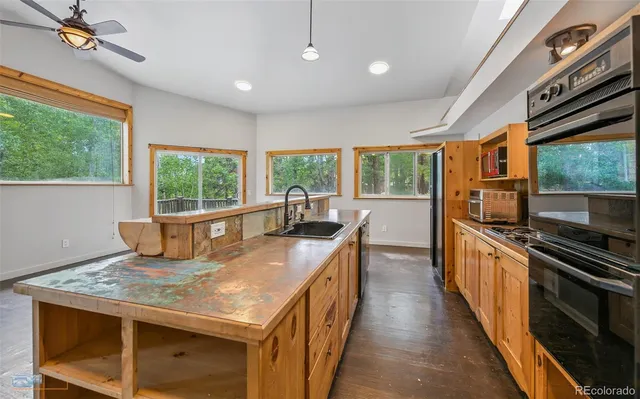 a view of deck with wooden floor and fence