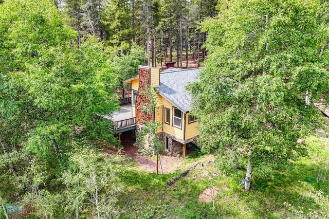a view of a house with a tree
