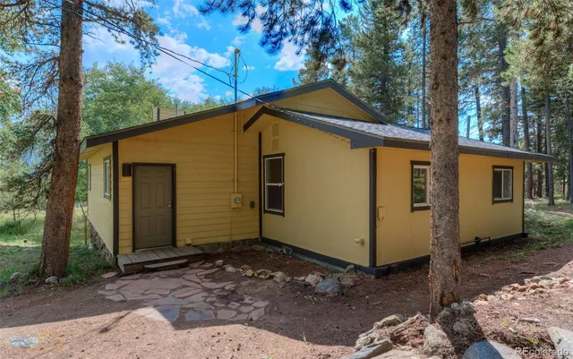 a view of an empty room with windows