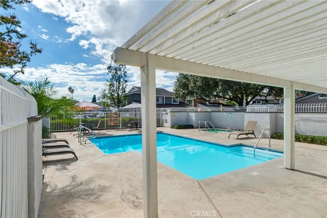 a view of a street with cars parked on the road