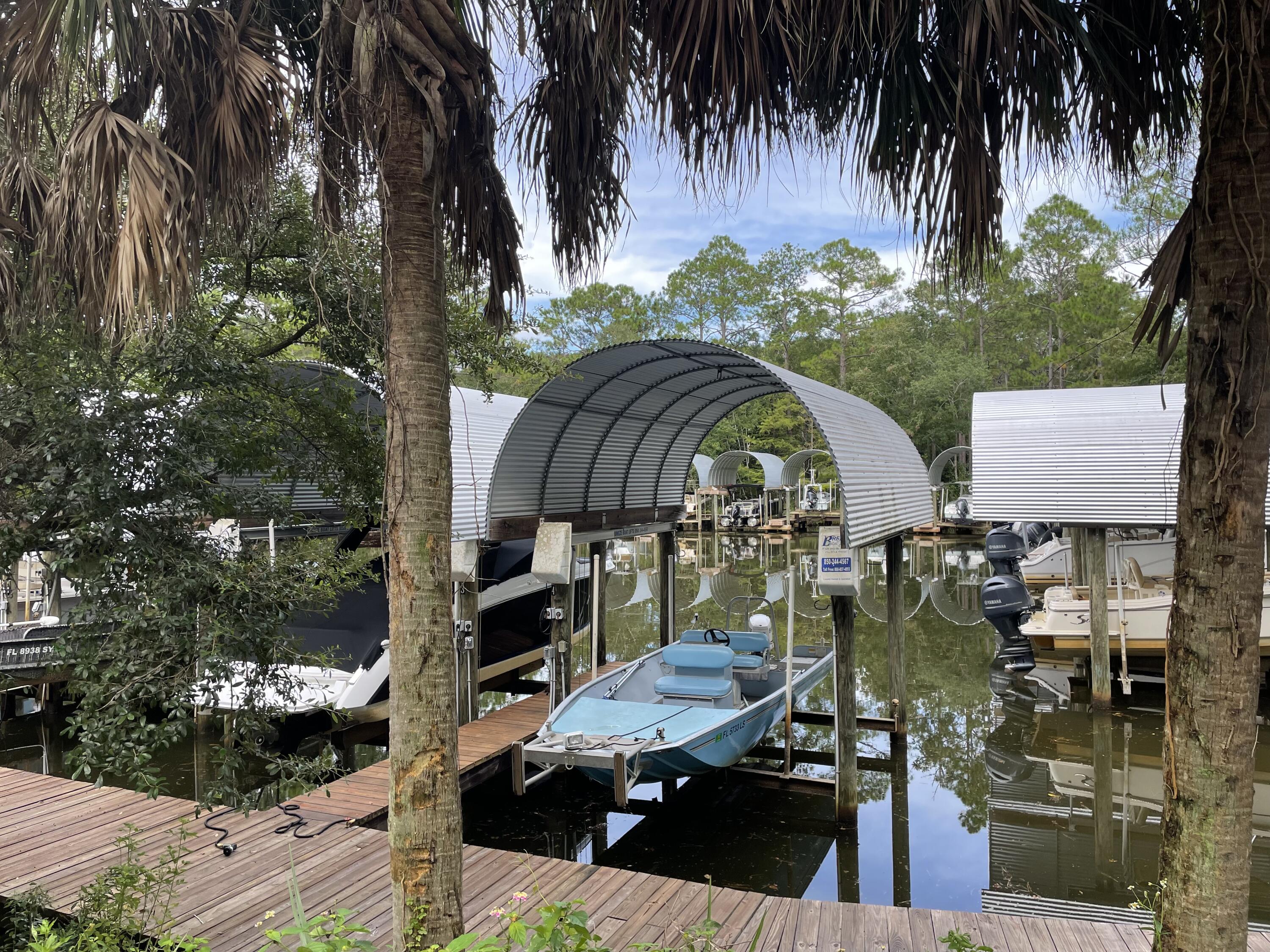 0 West Wild Blueberry Way Santa Rosa Beach, FL 32459 - Photo 14 of 19 a view of swimming pool with outdoor seating and plants