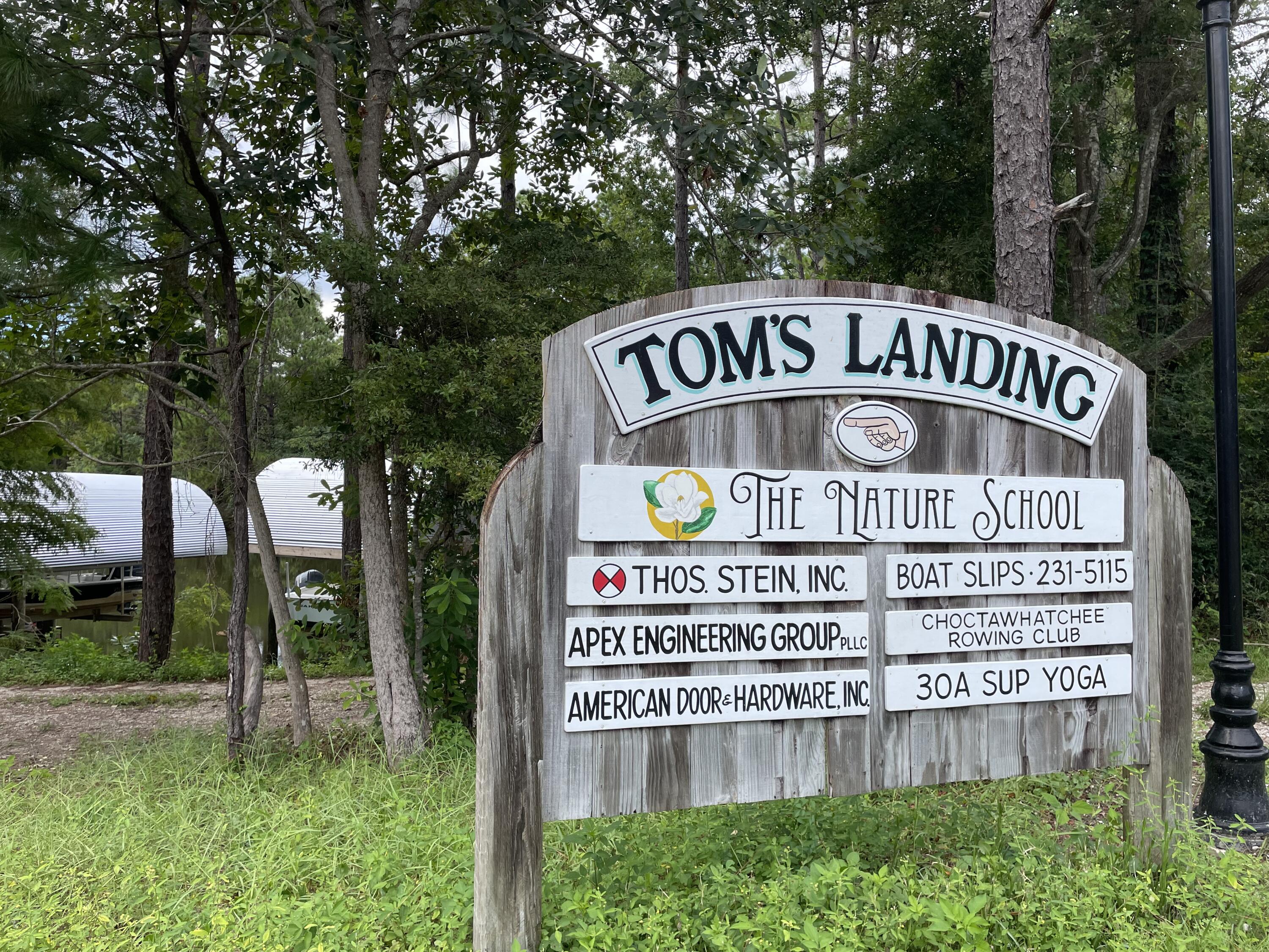 0 West Wild Blueberry Way Santa Rosa Beach, FL 32459 - Photo 15 of 19 a sign on the side of a building