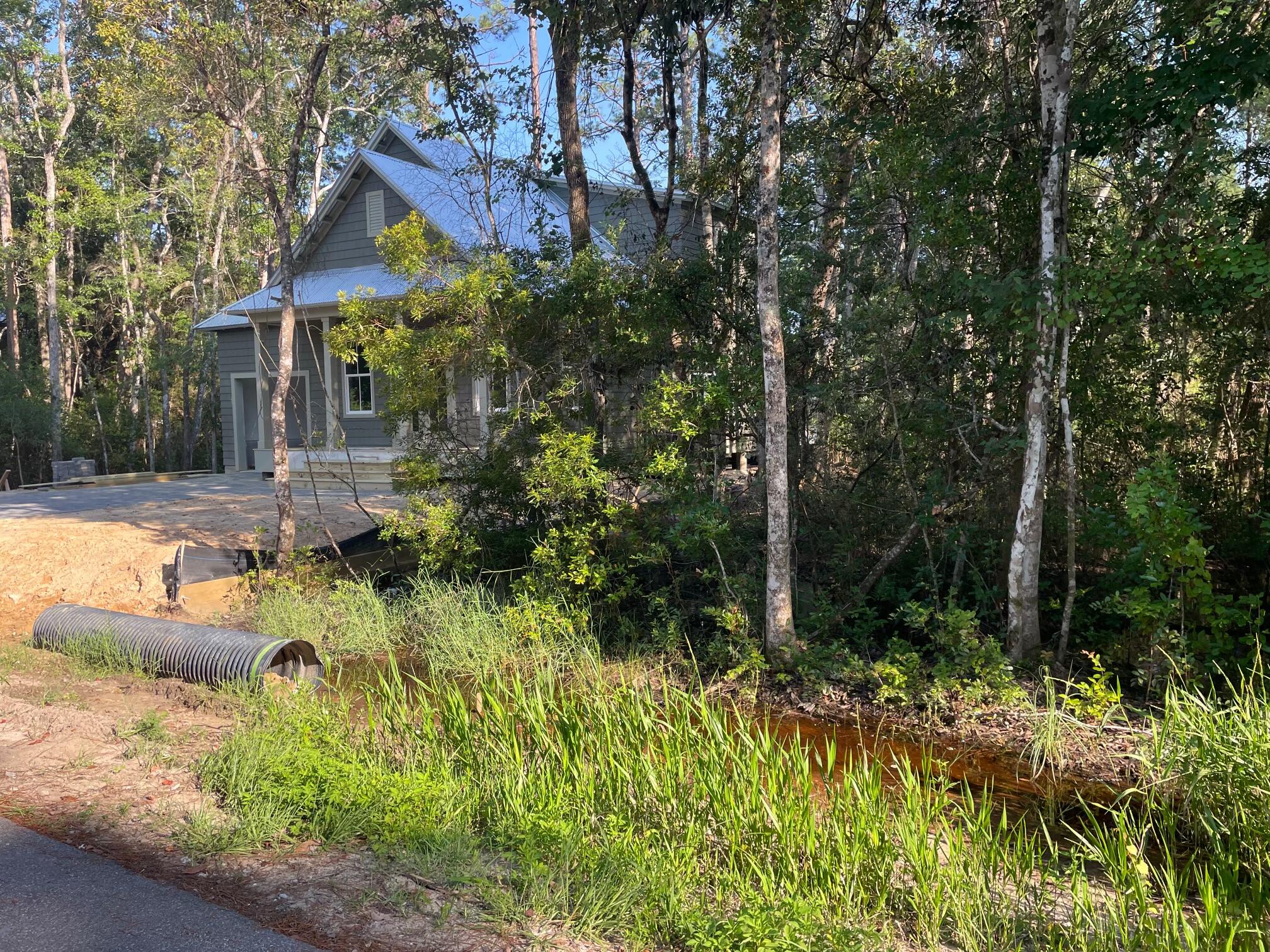 0 West Wild Blueberry Way Santa Rosa Beach, FL 32459 - Photo 9 of 19 a view of a house with a yard and sitting area