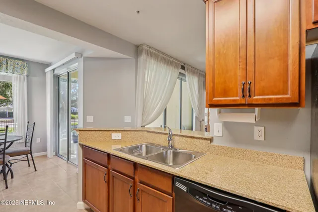 a kitchen with a sink and a window