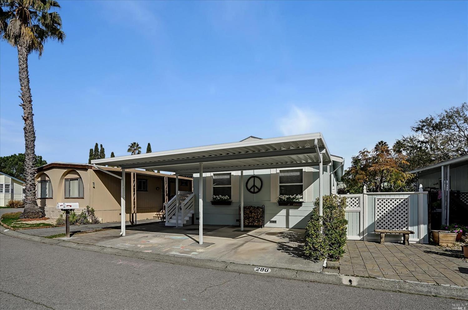 286 Yosemite Road San Rafael, CA 94903 - Photo 1 of 1 a front view of a house with a tree