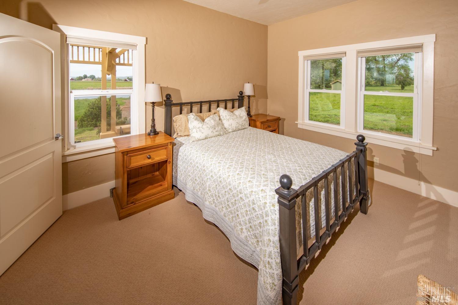 42369 Horr Road Fall River Mills, CA 96028 - Photo 16 of 43 a bed sitting in a bedroom next to a window