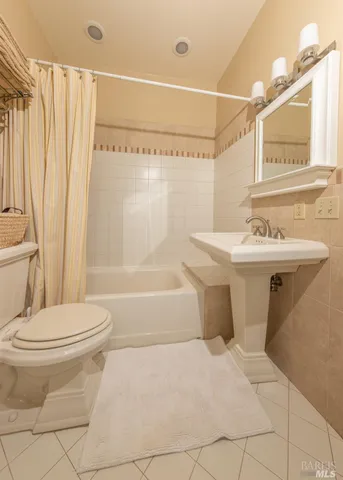 a view of a brick house with a small yard