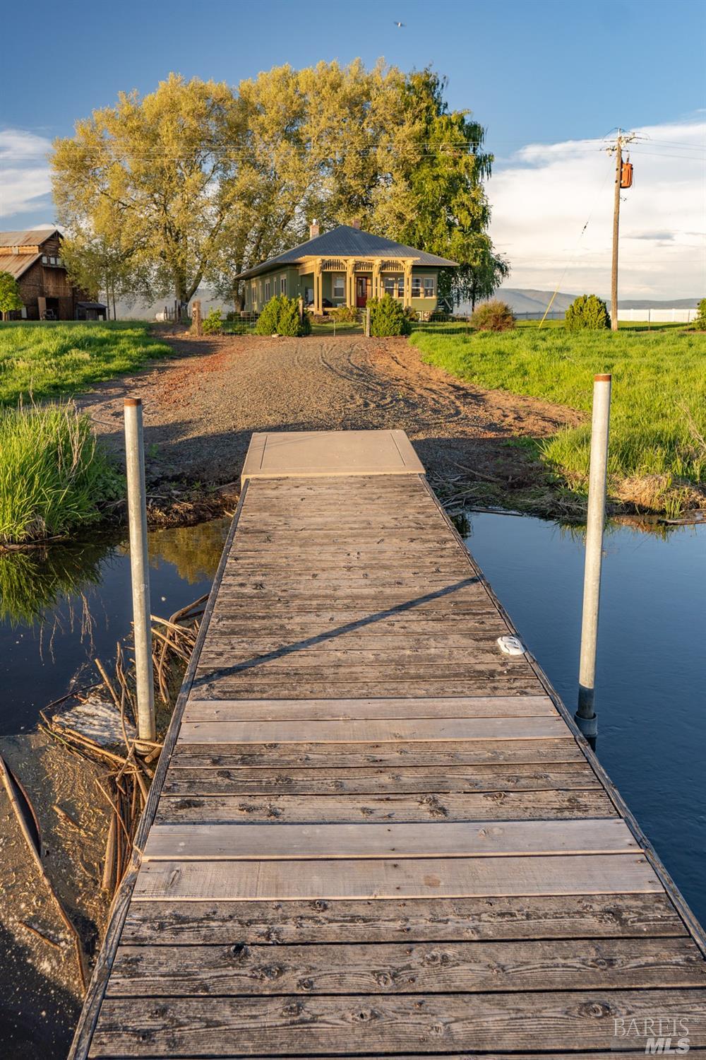42369 Horr Road Fall River Mills, CA 96028 - Photo 18 of 43 a view of a brick house with a small yard