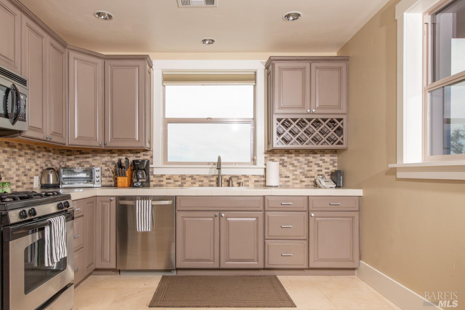 42369 Horr Road Fall River Mills, CA 96028 - Photo 25 of 43 a kitchen with a sink stove and cabinets