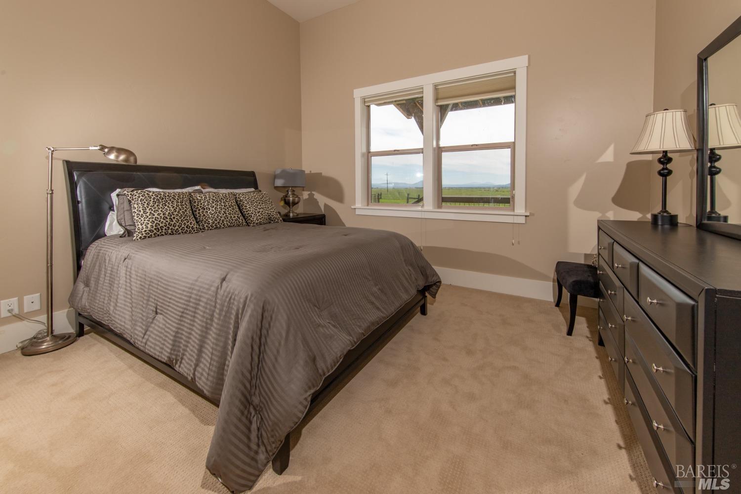 42369 Horr Road Fall River Mills, CA 96028 - Photo 27 of 43 a bed sitting in a bedroom next to a window