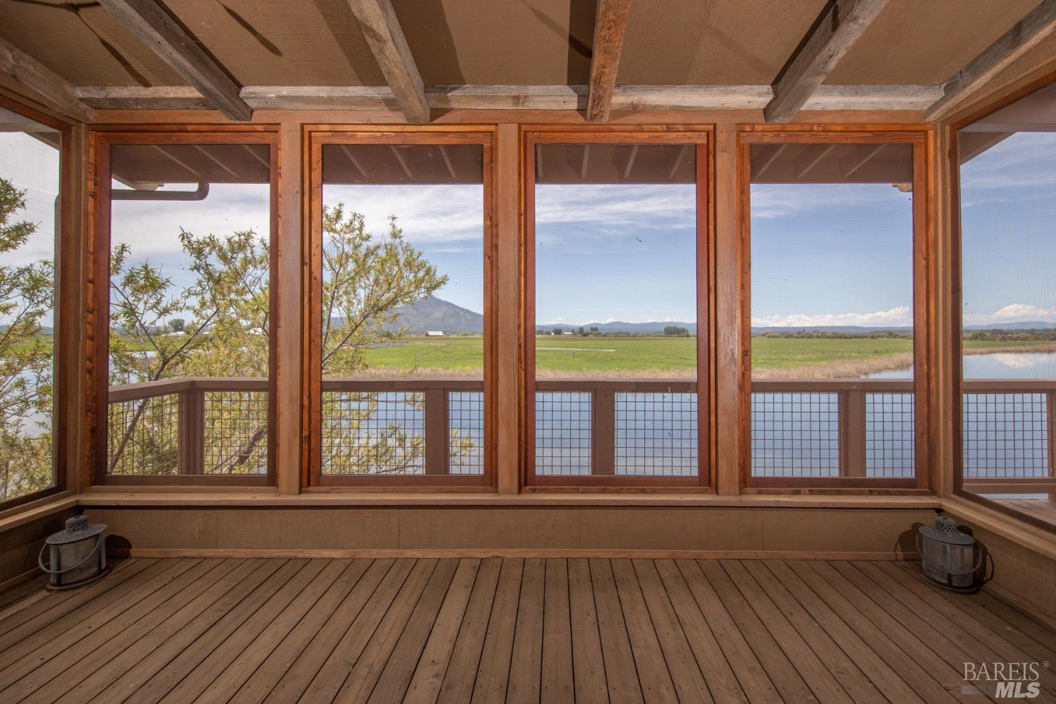 42369 Horr Road Fall River Mills, CA 96028 - Photo 29 of 43 a view of an empty room with wooden floor and a window