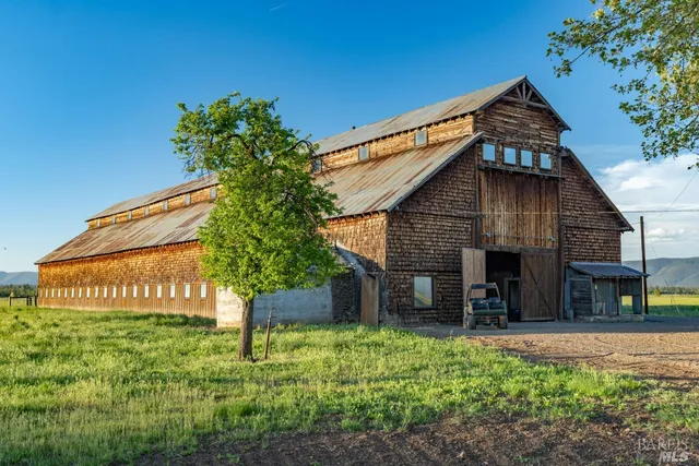 a backyard of a house with lots of green space