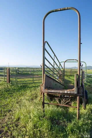 a swimming pool with outdoor seating and yard