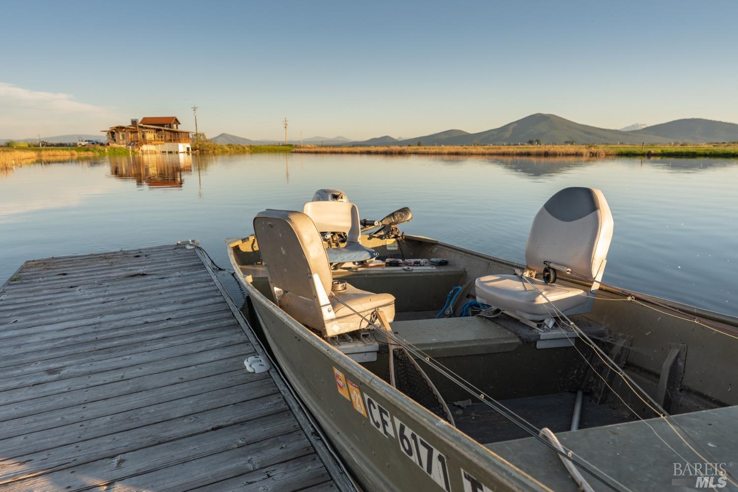 42369 Horr Road Fall River Mills, CA 96028 - Photo 43 of 43 a view of a balcony with wooden floor and lake view