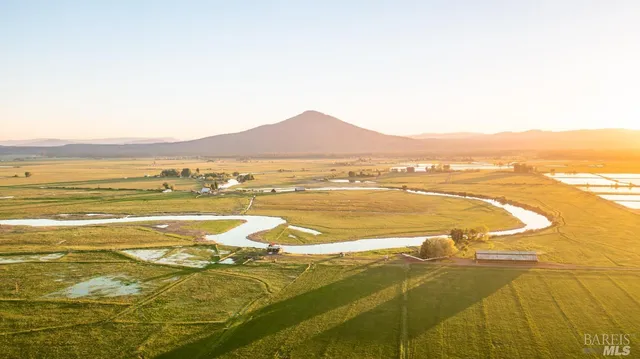 a view of an ocean and a yard