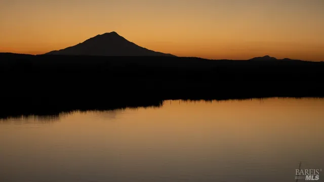 a view of a swimming pool and an outdoor seating