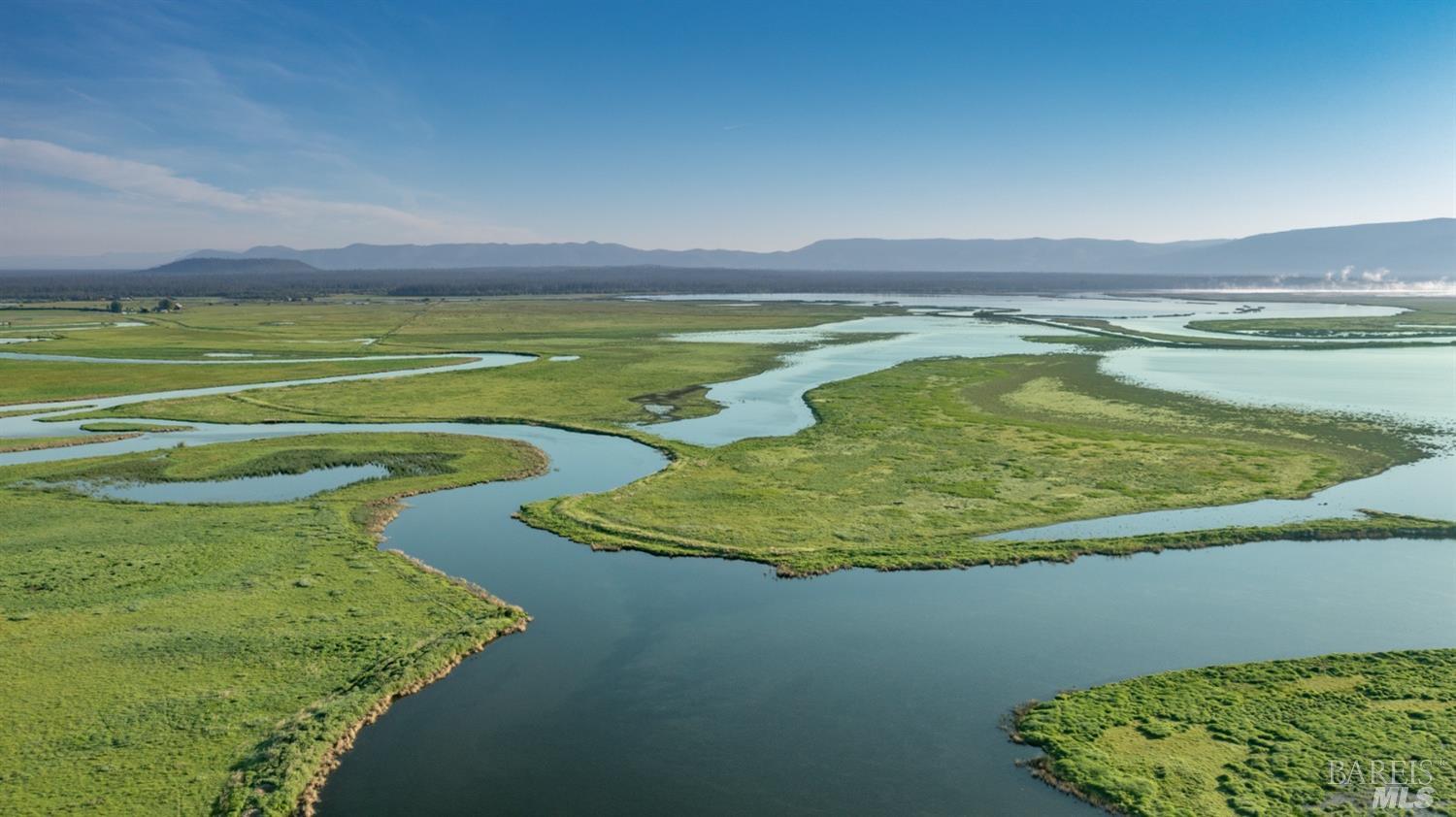 42369 Horr Road Fall River Mills, CA 96028 - Photo 8 of 43 a view of a swimming pool and an outdoor seating