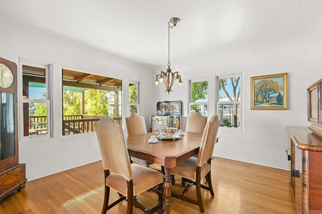 a view of a patio with table and chairs and potted plants