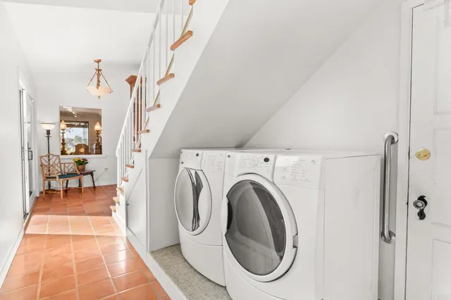 an aerial view of a house with a yard basket ball court and outdoor seating
