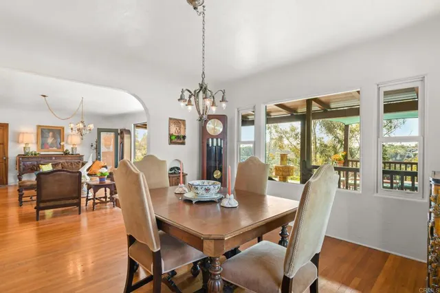 a bed sitting in a bedroom next to a large window