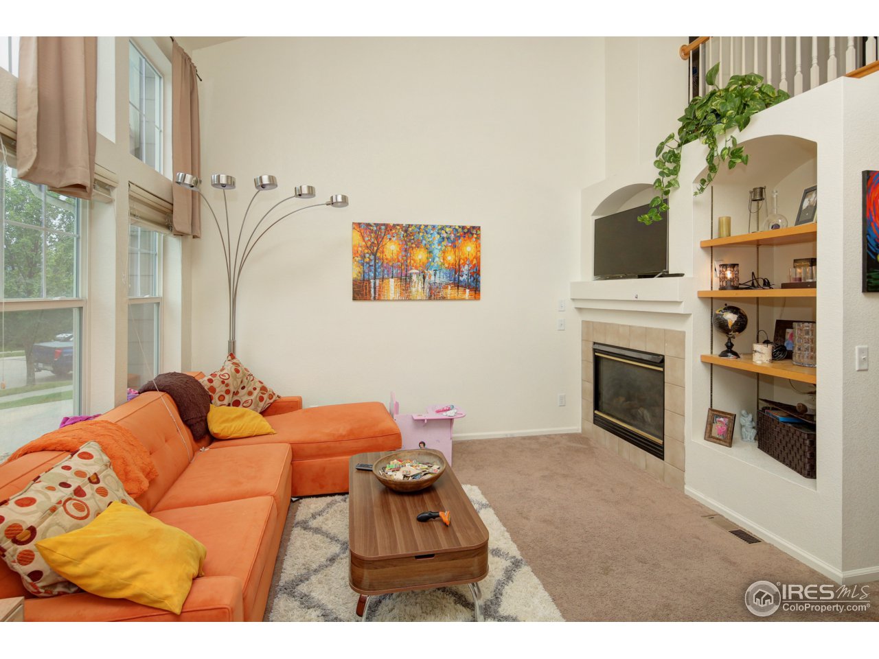 1902 Falcon Ridge Drive, Unit B Fort Collins, CO 80528 - Photo 6 of 19 Living Room with Fireplace