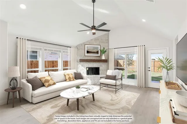 a living room with furniture a fireplace and a flat screen tv