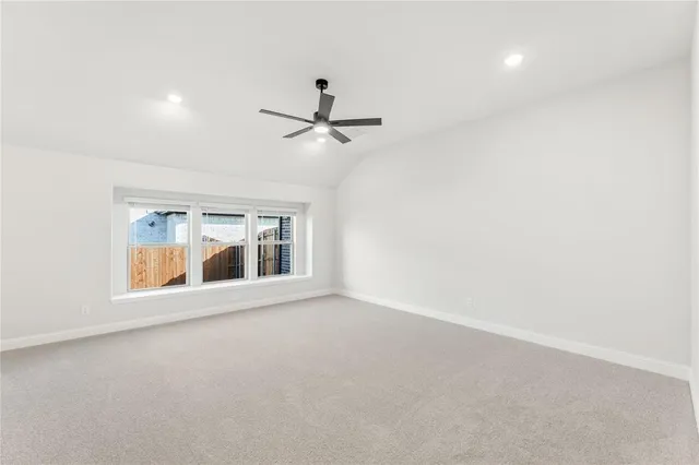 an empty room with a empty space and windows