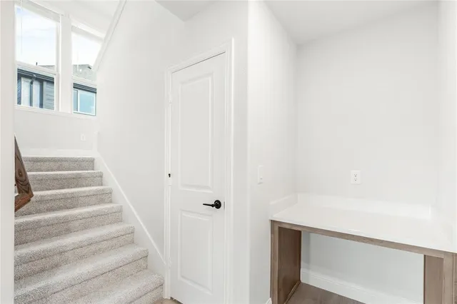 a view of staircase with white walls