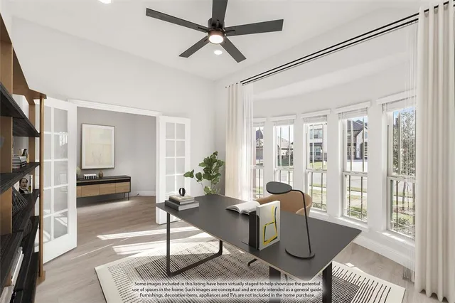 a living room with furniture and a floor to ceiling window