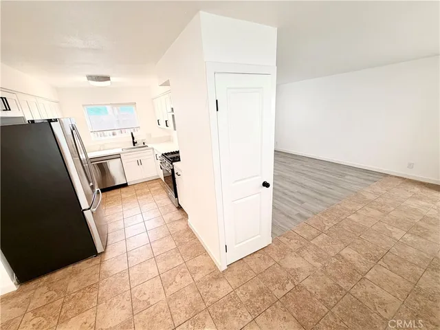 a view of a kitchen from the hallway