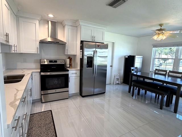 1629 Willow Run Sebring, FL 33872 - Photo 3 of 16 a kitchen with stainless steel appliances granite countertop a refrigerator a stove a sink and a microwave