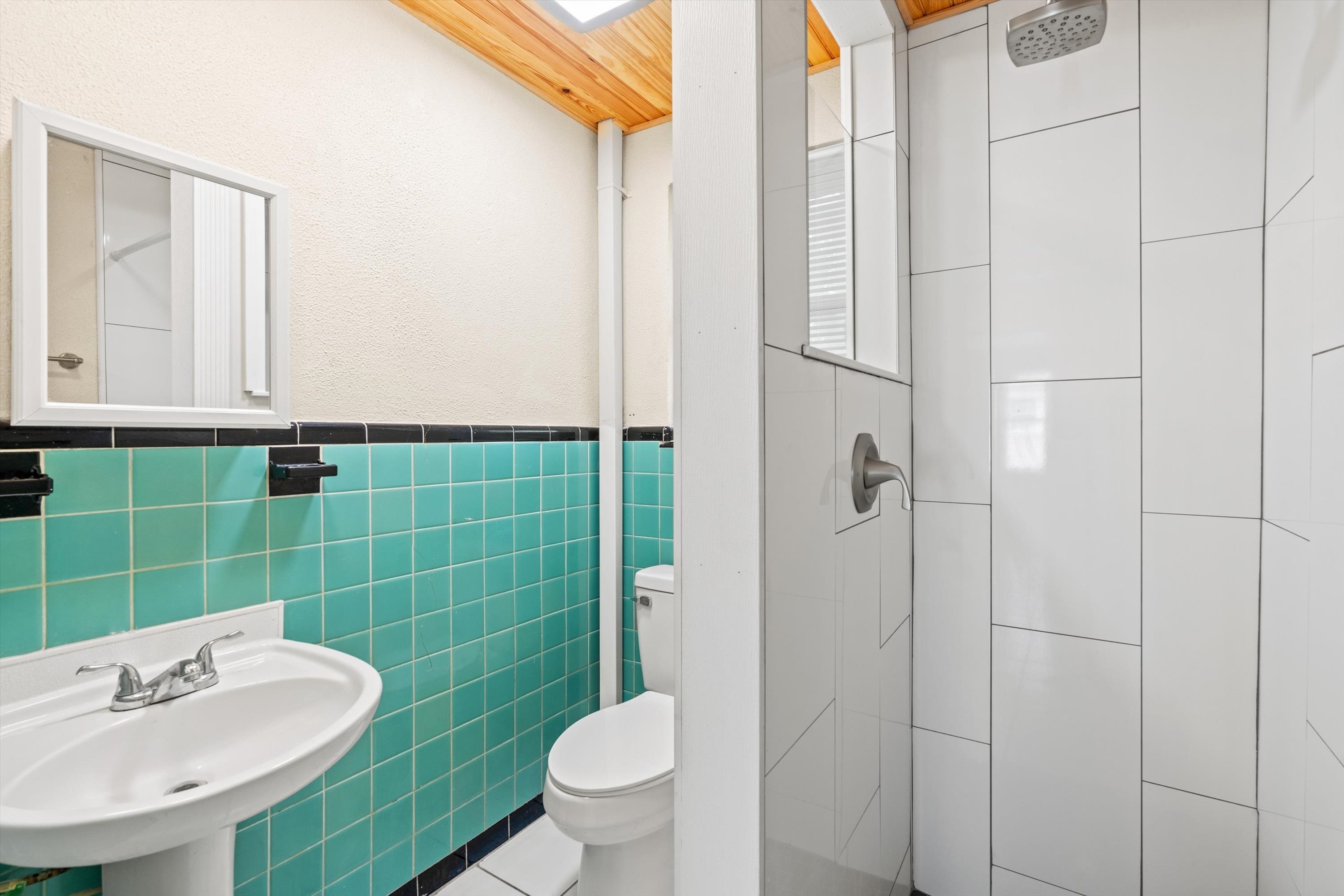 137 A Riberia Street St. Augustine, FL 32084 - Photo 11 of 21 a bathroom with a sink toilet and shower