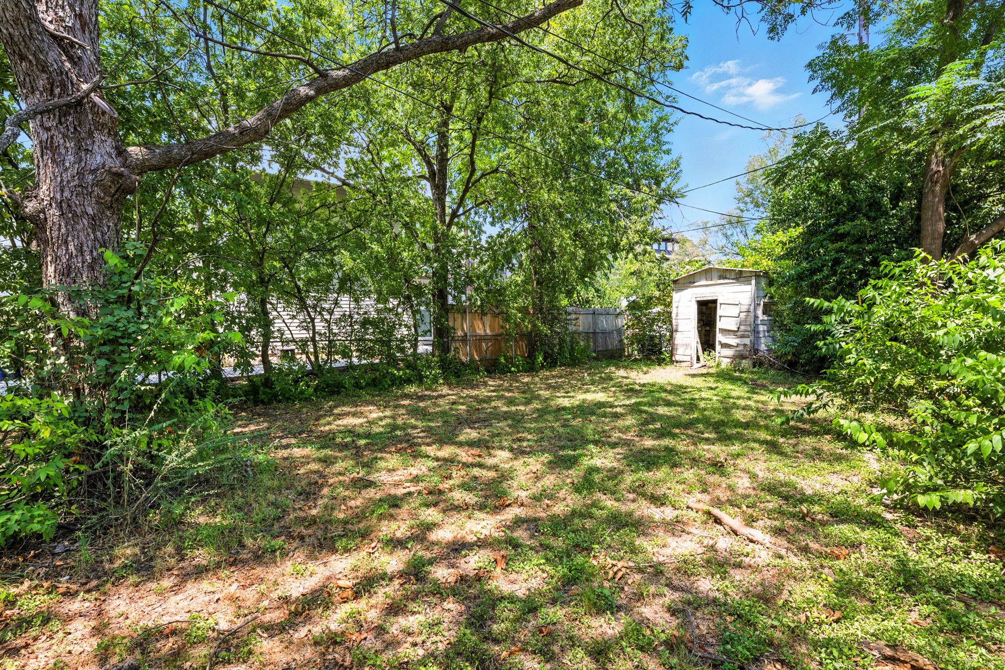 3709 Tower View Court Austin, TX 78723 - Photo 7 of 11 View of yard with a storage shed