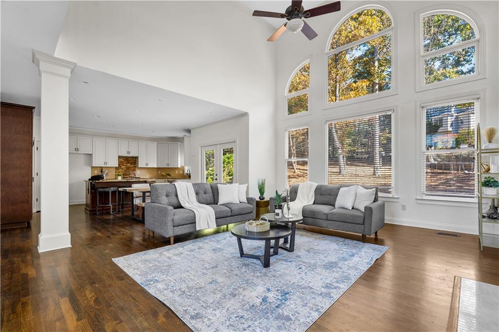 3713 Lake Edge Drive Suwanee, GA 30024 - Photo 12 of 50 a living room with fireplace furniture and wooden floor