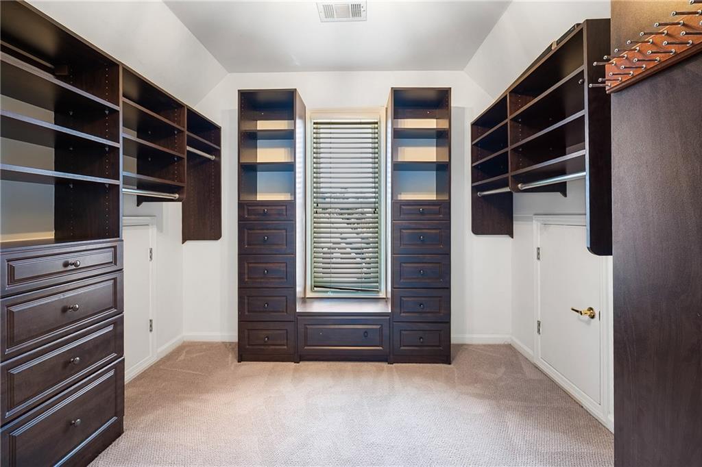 3713 Lake Edge Drive Suwanee, GA 30024 - Photo 22 of 50 a view of closet area with empty racks