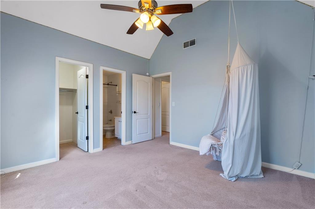 3713 Lake Edge Drive Suwanee, GA 30024 - Photo 27 of 50 a view of an empty room with window chandelier fan