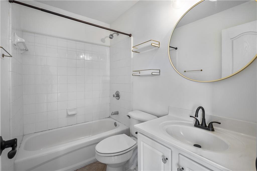 3713 Lake Edge Drive Suwanee, GA 30024 - Photo 28 of 50 a bathroom with a sink toilet and shower