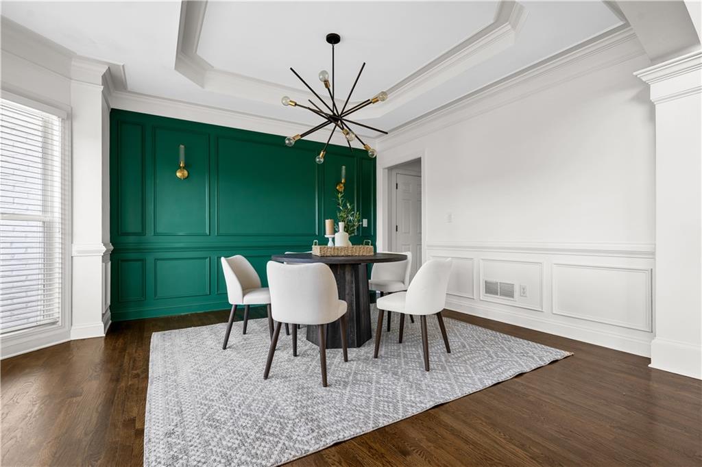 3713 Lake Edge Drive Suwanee, GA 30024 - Photo 3 of 50 a view of a dining room with furniture window and wooden floor